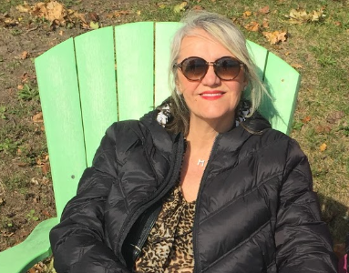 Chair, Furniture, Clothing, Apparel, Coat, Jacket, Sunglasses, Accessories, Accessory, Person