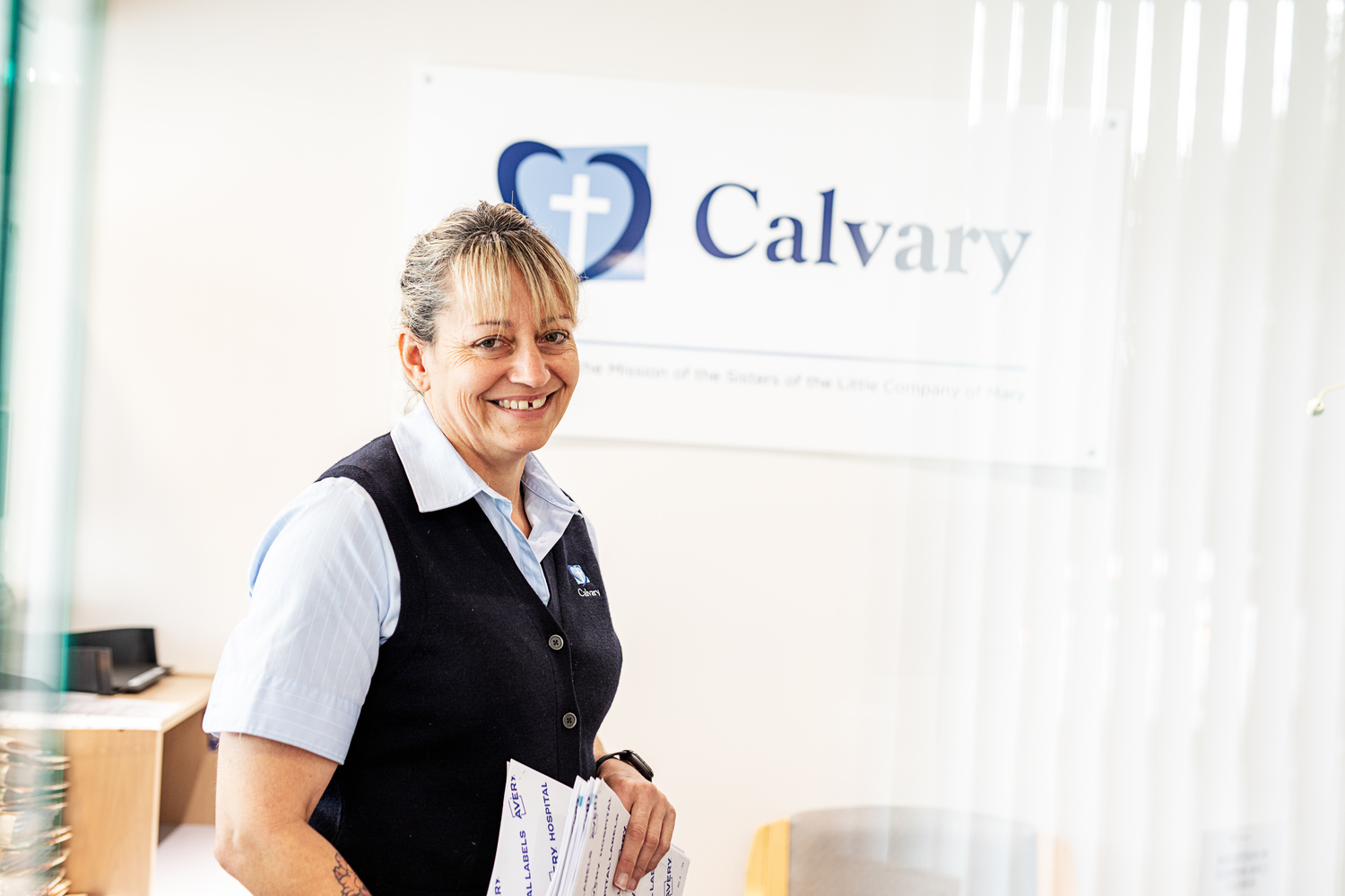 Clothing, Person, Long Sleeve, Sleeve, Text, Shirt, Sitting, Suit, Advertisement, Evening Dress