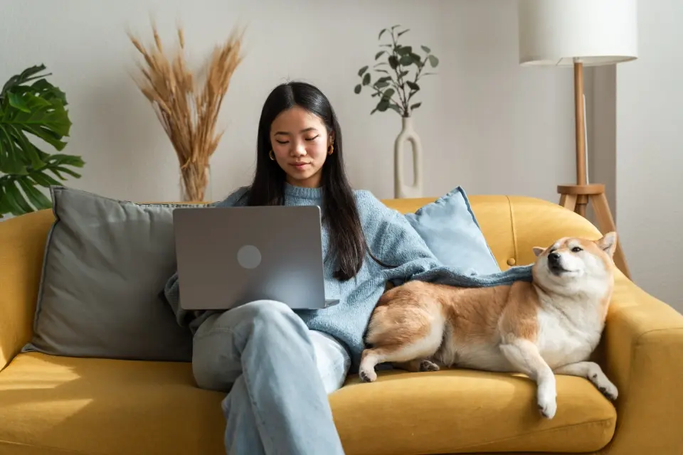 Person, Sitting, Dog, Pet, Blanket, Couch, Lamp, Laptop, Head, Face