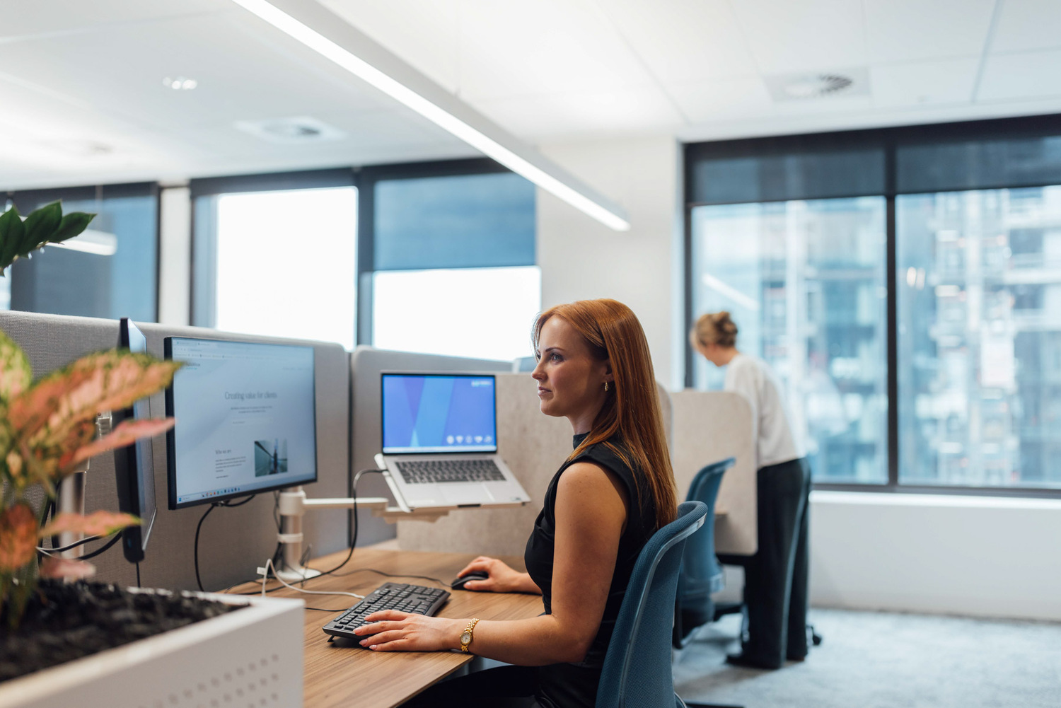 Furniture, Table, Desk, Adult, Female, Person, Woman, Computer Keyboard, Laptop, Face