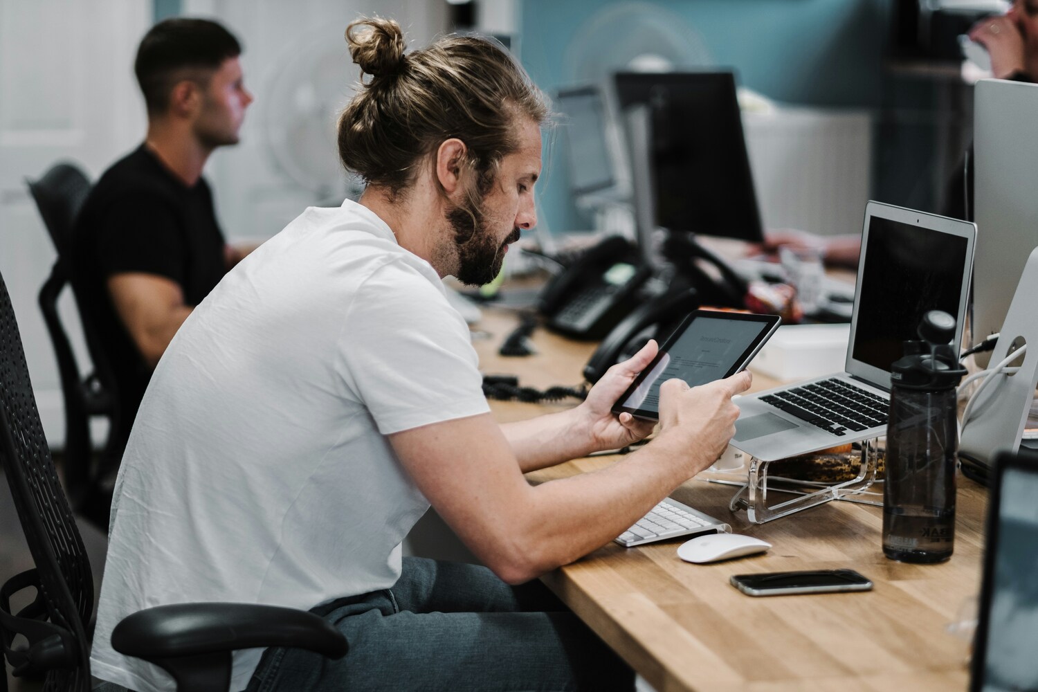 Tablet Computer, Mobile Phone, Computer Keyboard, Laptop, Adult, Male, Man, Person, Head, Table