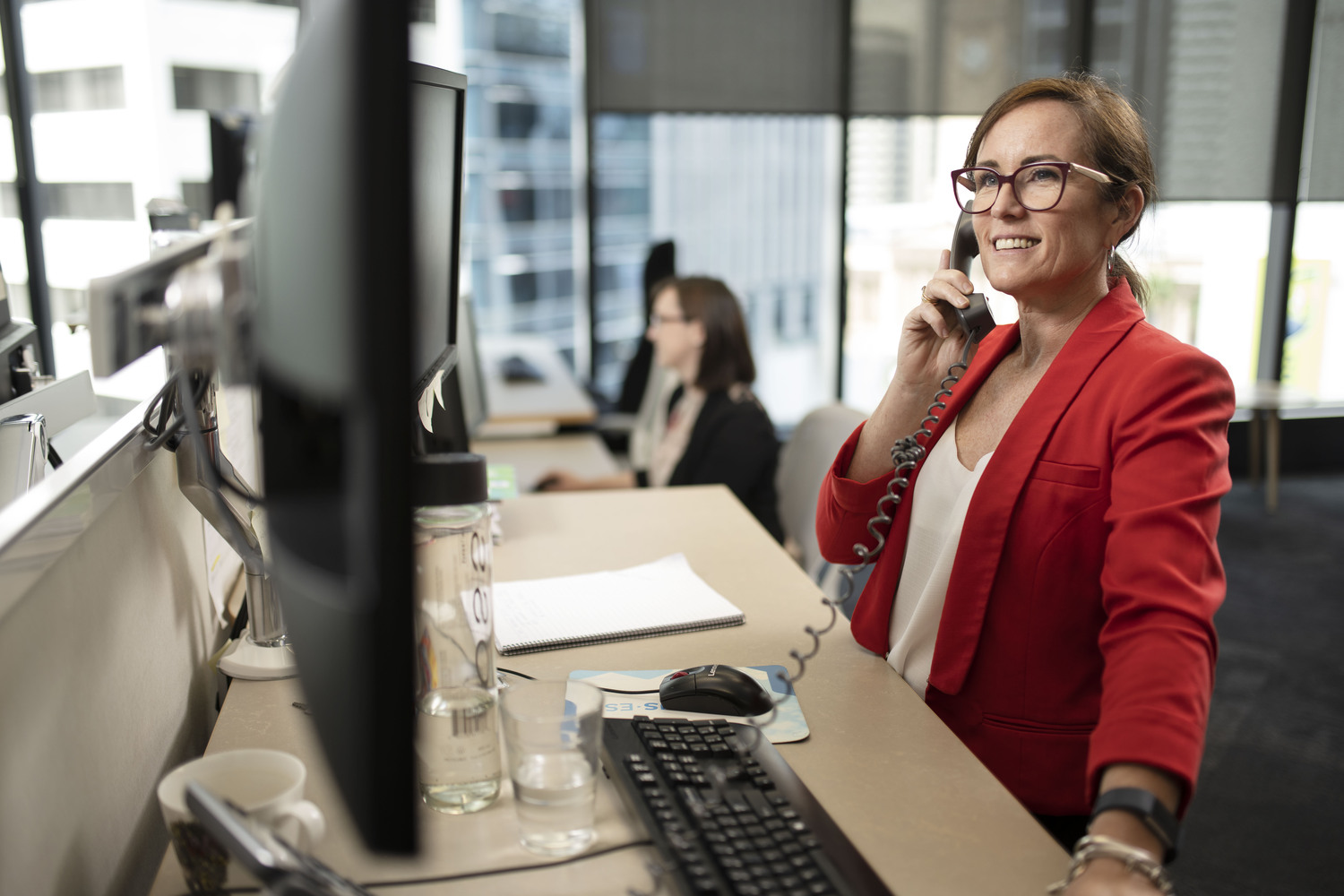 Computer Keyboard, Table, Executive, Person, Adult, Female, Woman, Desk, Glasses, Coat